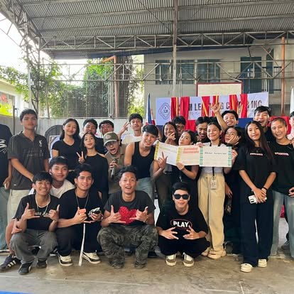 Alcians posing together on the covered court