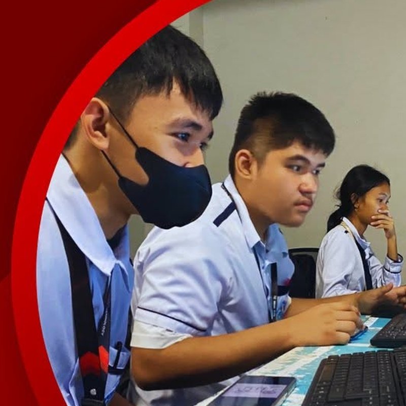 Students working at computer workstations in the ICT lab